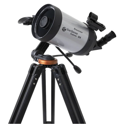 Silver and black telescope on a tripod.