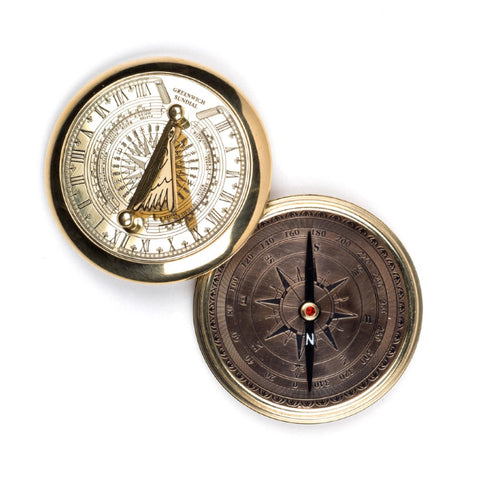 Etched brass sundial and compass.