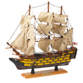 Large HMS Victory model ship with extended sails.