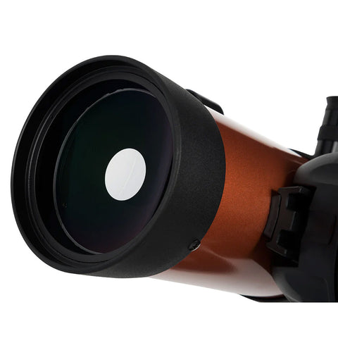 Close-up of orange and black telescope.