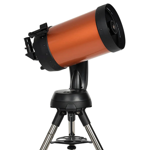 Orange and black telescope with tripod.