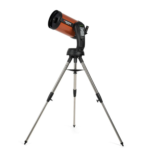 Orange and black telescope with control pad and tripod.