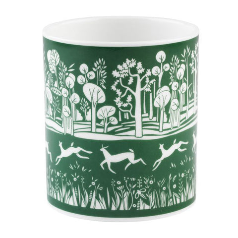 White mug with a green park illustration.