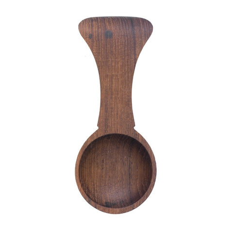 Dark wood tea scoop with handle.