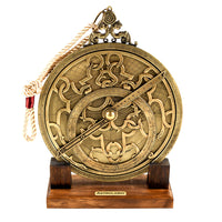 astrolabe resting on wooden stand