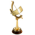 Brass equatorial sundial on wooden base.