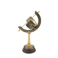 Side view of brass equatorial sundial on wooden base.