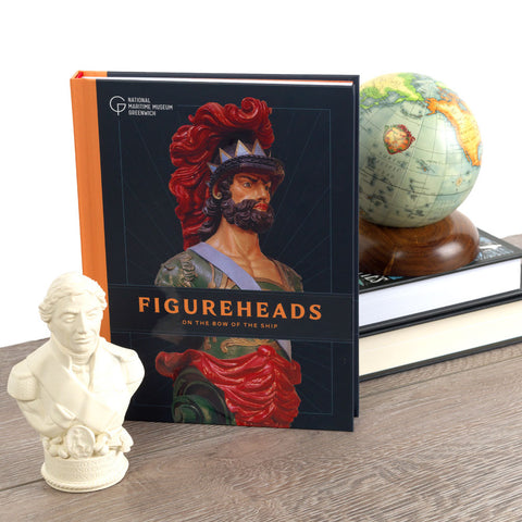 Hardback Figureheads book with globe, books and bust.