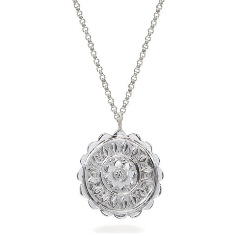 Silver pendant necklace with embossed flower pattern.