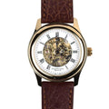 Gold watch with white face, visible mechanism and a dark brown strap.