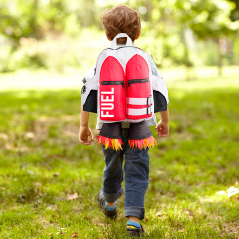 Child wearing colourful backpack in the style of a jetpack.