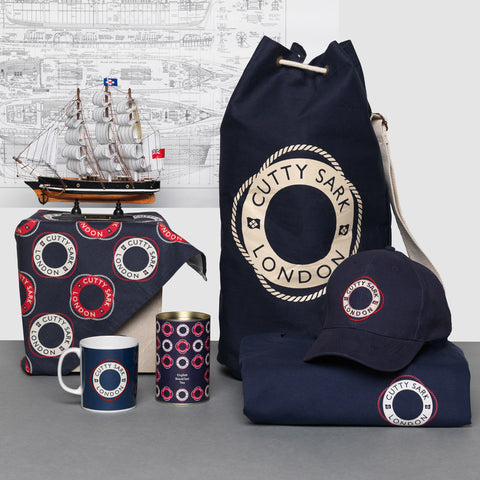 A selection of navy accessories including cap, duffel bag and cap.