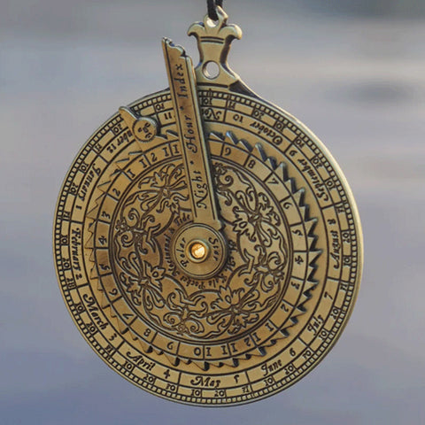 Circular brass instrument with calendar engravings.