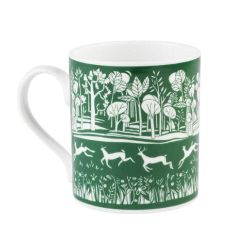 White mug with green park illustration.