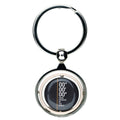 Round metal keyring with Meridian Line design.