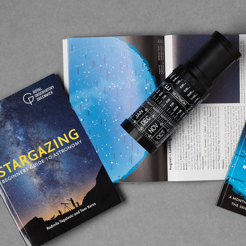 Stellarscope next to a book, Stargazing: Beginners Guide to Astronomy.