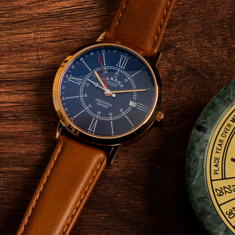 Camden watch with navy face, pale gold details and brown leather strap.